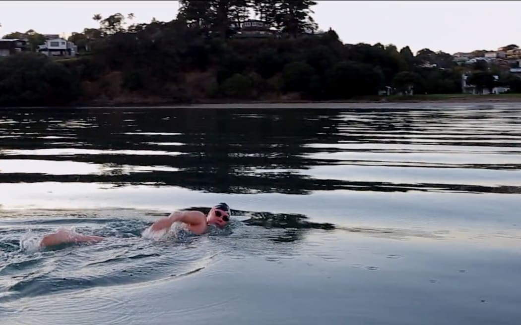 Caitlin O'Reilly training in the cold waters off Manly Beach, Whangaparaoa.