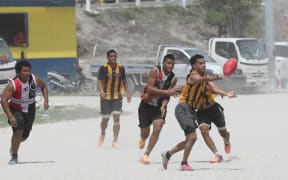 Local AFL games in Nauru - played on the gravel ground.