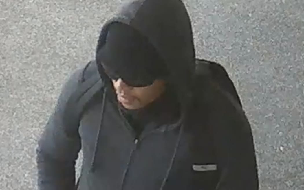 The man was spotted on CCTV walking by the store about 30 minutes prior to the robbery.