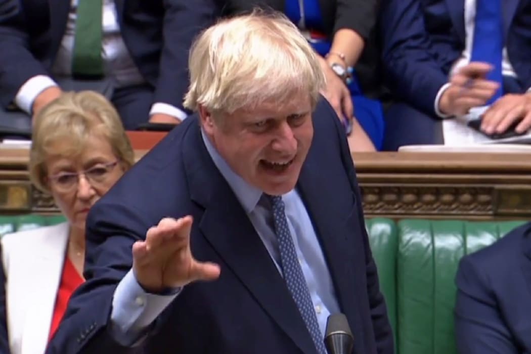 A video grab from footage broadcast by the UK Parliament's Parliamentary Recording Unit (PRU) shows Britain's Prime Minister Boris Johnson gestures as he gives a statement in the House of Commons in central London on September 25, 2019.