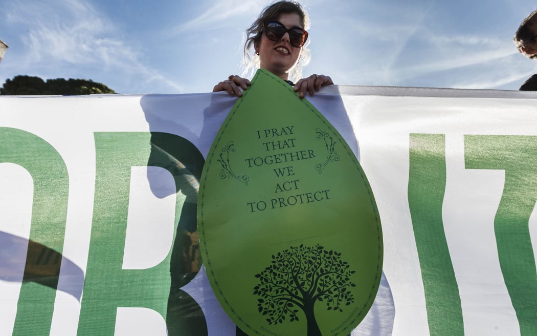 Hundreds of people take part in a 'March for the Earth' to show support for Pope Francis’ call for climate action in Rome on November 8, 2015 (Photo by Giuseppe Ciccia/NurPhoto)