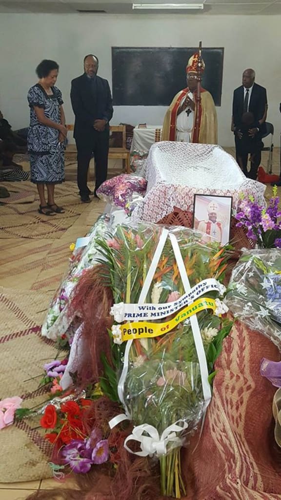 Prime Minister Charlot Salwai pays is respects to the late Bishop James Ligo.