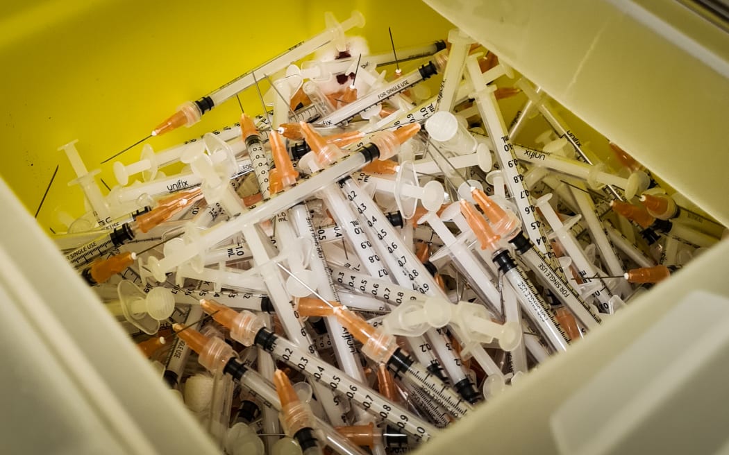 Bin of discarded needles