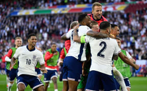 (From L) England's midfielder #10 Jude Bellingham, England's forward #17 Ivan Toney, England's goalkeeper #01 Jordan Pickford, England's forward #09 Harry Kane and England's defender #08 Trent Alexander-Arnold celebrate after winning the UEFA Euro 2024 quarter-final football match between England and Switzerland at the Duesseldorf Arena in Duesseldorf on July 6, 2024. (Photo by INA FASSBENDER / AFP)