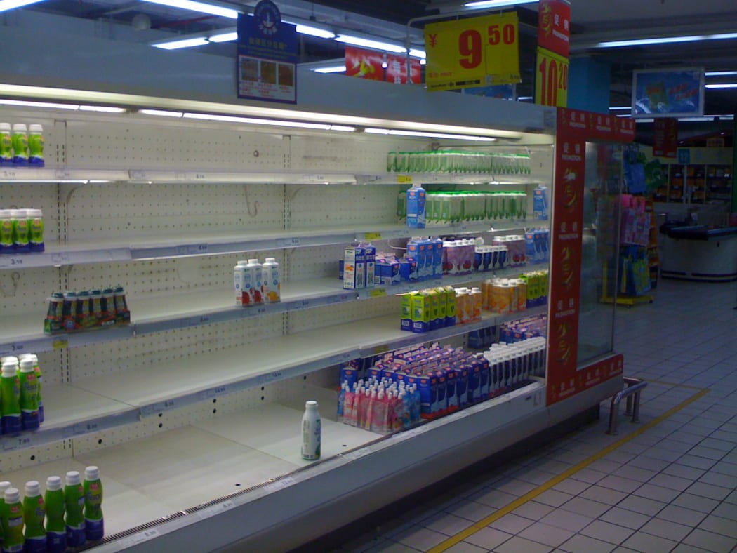 Chinese milk products are removed from supermarkets in China as a result of the melamine milk scandal in 2008