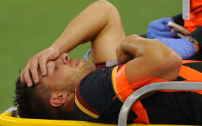 The Wales halfback Rhys Webb leaves the field injured.