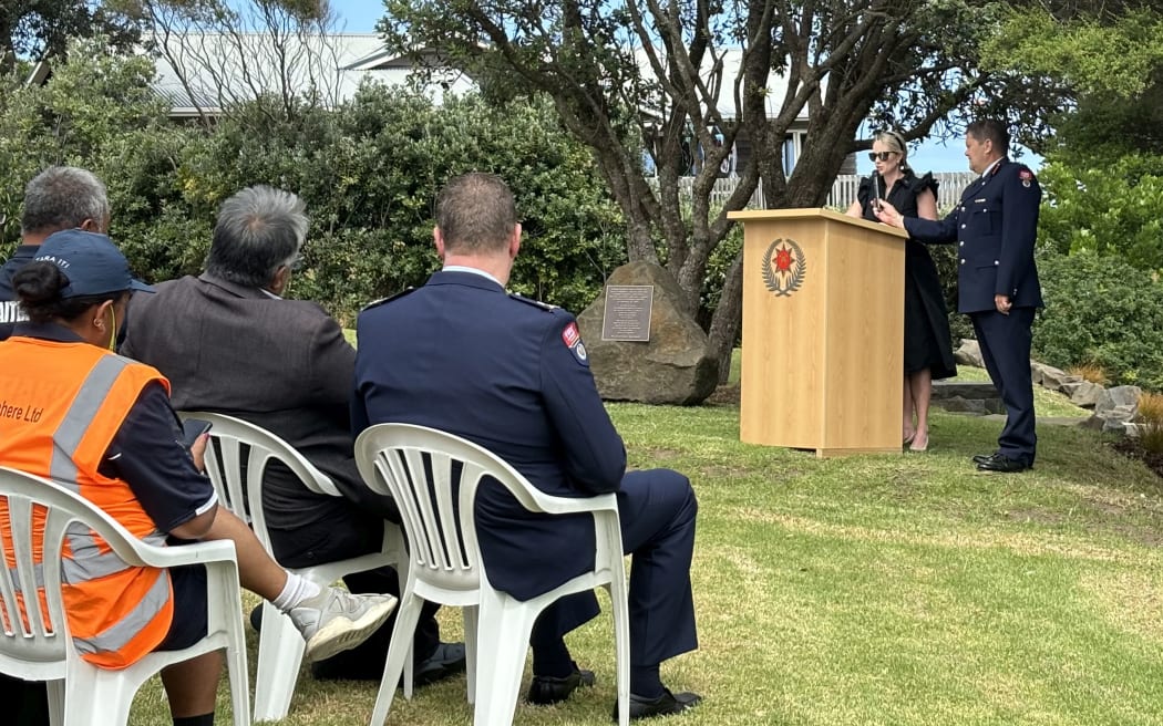 Amy Van Zwanenberg speaking about her husband David van Zwanenberg, killed in a slip last year, during a memorial service in Muriwai.
