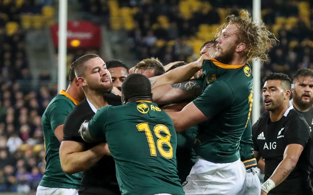 All Blacks hooker Dane Coles mixes it up with the Springboks.