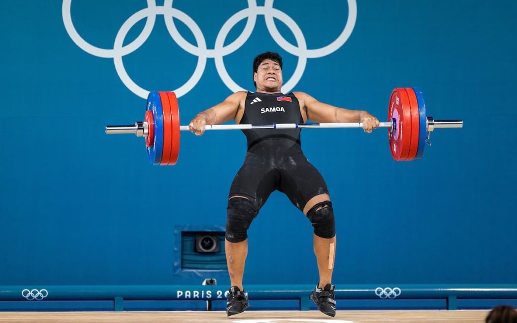 Samoa's Don Opeloge struggles in the snatch event at the Paris Olympics on Saturday night. Kirk Corrie/ONOC