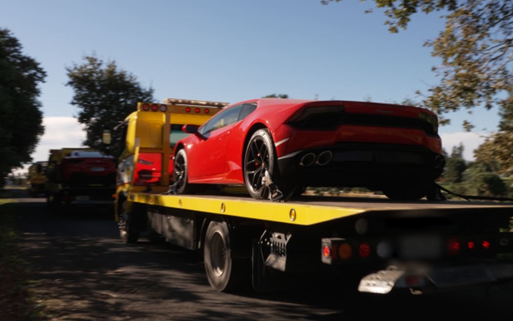 A Lamboghini Huracan restrained by police as part of the country's largest drug bust.