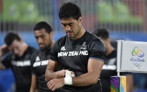 Akira Ioane reacts after defeat in the men’s sevens quarter-final match between Fiji and New Zealand during the Olympic Games.