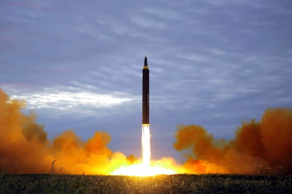This picture from North Korea's KCNA - taken on 29 August 2017 - reportedly shows the Hwasong-12 missile lifting off from an undisclosed location near Pyongyang.
