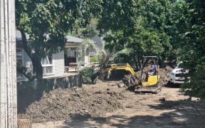 Houses on Joll Road in Havelock North were inundated with contaminated mud during Cyclone Gabrielle, but the community and Navy pitched in to help clean up the street and homes.