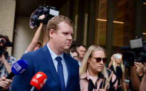 Former NSW Police officer Kristian White entered NSW Supreme Court for sentencing surrounded by supporters.