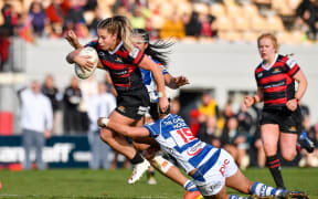 Amy du Plessis of Canterbury is tackled by Kiritapu Demant of Auckland during the Farah Palmer Cup 2022.