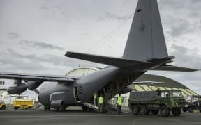 A Royal New Zealand Air Force C-130 Hercules transporting vehicles and other equipment and the Ōhakea base this morning.