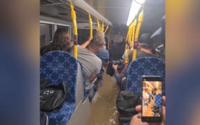 An Auckland bus taking passengers away from Mt Smart Stadium after Elton John was cancelled on Friday night flooded during the severe weather event.