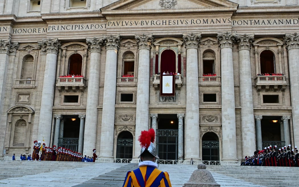 Newly elected Pope Leo XIV, Robert Prevost addresses the crowd from the main central loggia balcony of the St Peter's Basilica for the first time, after the cardinals ended the conclave, in The Vatican, on May 8, 2025. Robert Francis Prevost was on Thursday elected the first pope from the United States, the Vatican announced. A moderate who was close to Pope Francis and spent years as a missionary in Peru, he becomes the Catholic Church's 267th pontiff, taking the papal name Leo XIV. (Photo by Tiziana FABI / AFP)