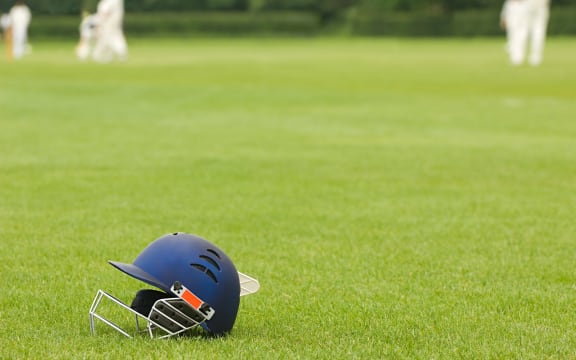Cricket helmet on a cricket ground (Photo by Harris Artemis / Connect Images via AFP)