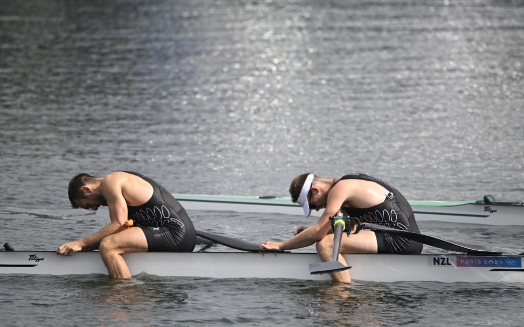 New Zealand's Phillip Wilson (L) and New Zealand's Daniel Williamson react after competing in the men's pair semifinal A/B rowing competition at Vaires-sur-Marne Nautical Centre in Vaires-sur-Marne during the Paris 2024 Olympic Games on July 31, 2024. (Photo by Olivier MORIN / AFP)