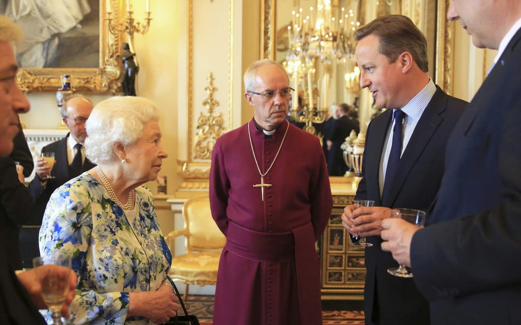 British PM David Cameron talks to Queen Elizabeth II.
