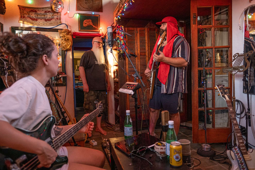 Marika Hodgson, Dave Catching, and Troy Kingi inside Rancho de la Luna