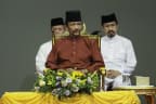 Brunei's Sultan Hassanal Bolkiah (C) attends an event in Bandar Seri Begawan on April 3, 2019.