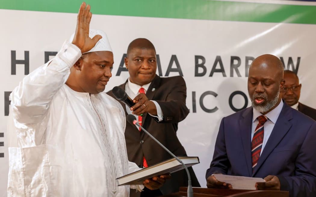 Adama Barrow being sworn in as president of Gambia at the Gambian embassy in Senegal.