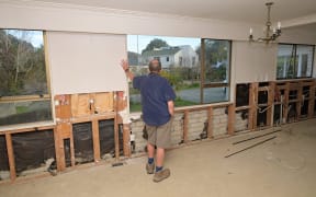 Ron looks out the window during a visit to the Vogel St home this week. The tenants were evacuated during Cyclone Gabrielle, and he remembers seeing them walk out with piles of clothes in their hands.