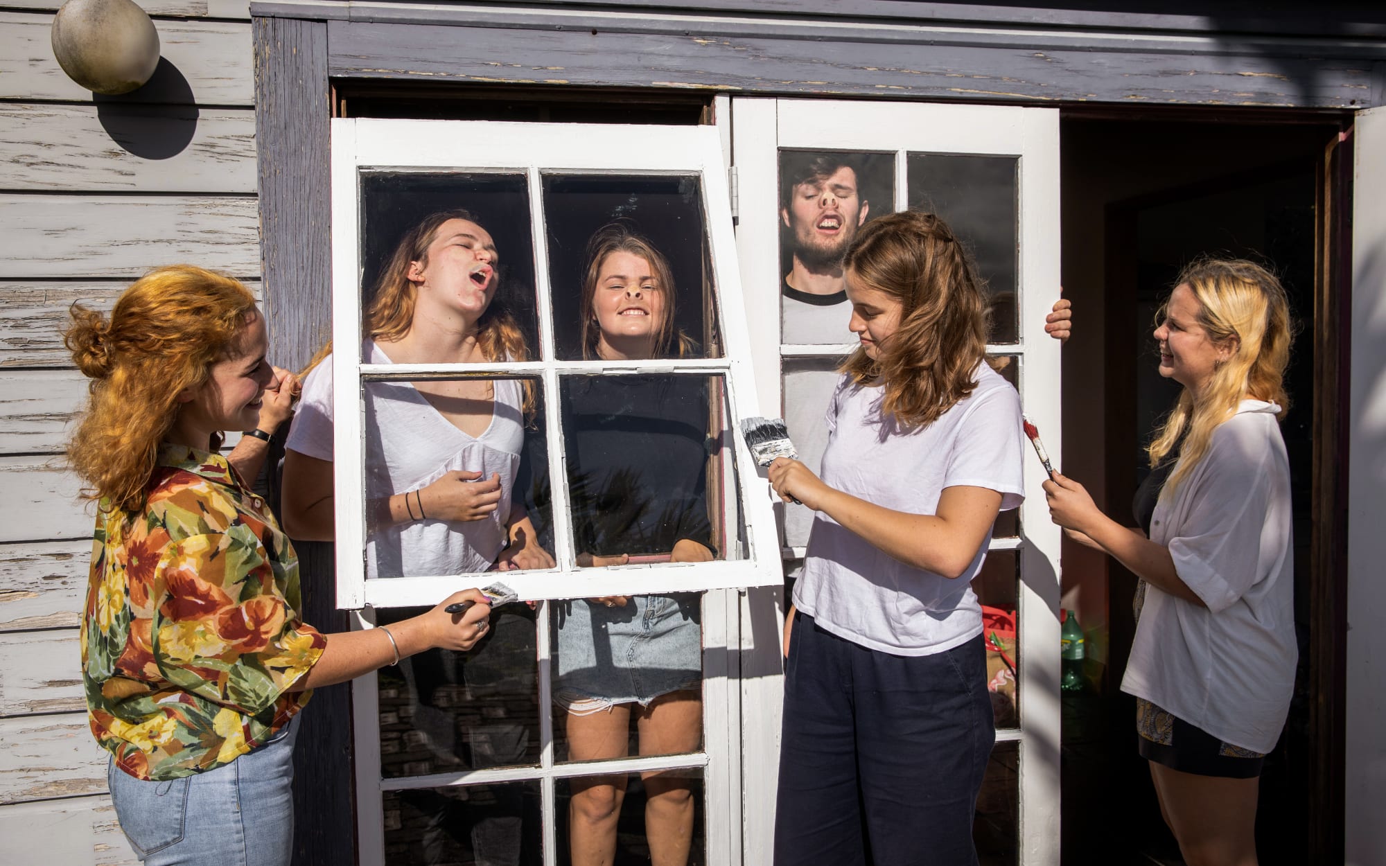 Portraits of people in lockdown. Claudia and her five flatmates at their Wellington home.
