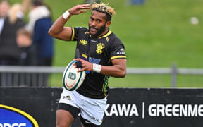 Esi Komaisavai of Wellington celebrates a try against Hawke's Bay.