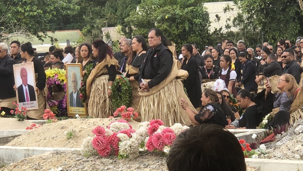 Mourners gather at the gravesite of 'Akilisi Pohiva