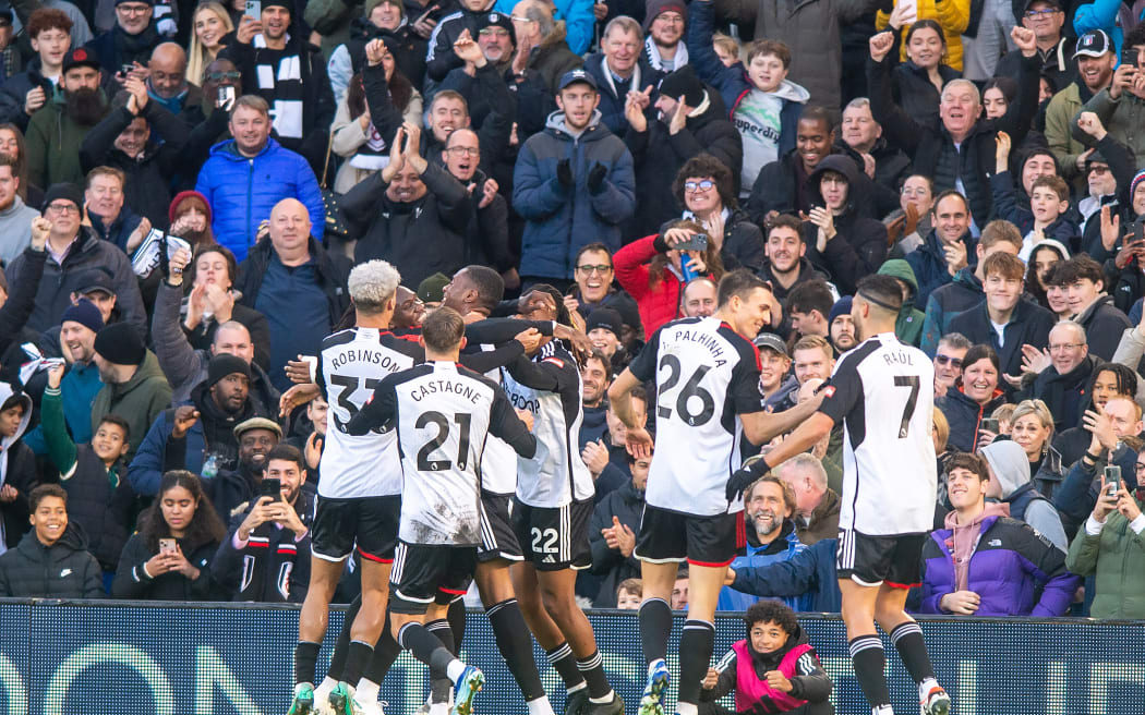 Fulham players celebrate a goal.