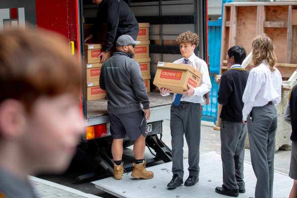 Rongotai College is back to help Wellington Library move books back in