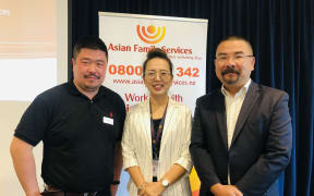 Bo Ning (left) and Kelly Feng from Asian Family Services and Dr Andrew Zhu (right) of Trace Research.