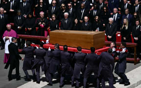 Pallbearers carry the coffin during late Pope Francis' funeral ceremony at St Peter's Square at the Vatican on April 26, 2025. (Photo by Filippo MONTEFORTE / AFP)