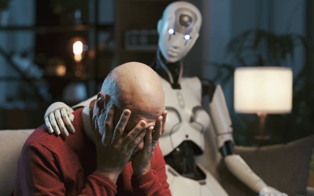 AI robot sitting next to a lonely senior man and comforting him, human-robot relationship concept