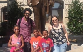 New Zealander Rosie Manins (right) with husband Jamaica and children at the statue of Martin Luther King Jr. at the Georgia State Capitol.
