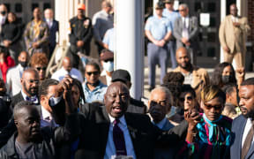 Marcus Arbery, father of Ahmaud Arbery, attorney Ben Crump, Rev. Al Sharpton, Wanda Cooper-Jones, mother of address members of the media following guilty verdicts for the defendants in the trial of the killers of Ahmaud Arbery on November 24, 2021