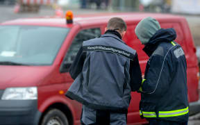 Members of the bomb disposal work at the scene where the unexploded bomb was discovered near Berlin.