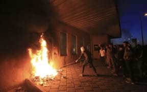 Outraged Iraqi protesters storm the US embassy in Baghdad.