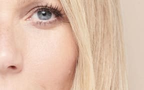 A close-up of an attractive blonde womnan's face.