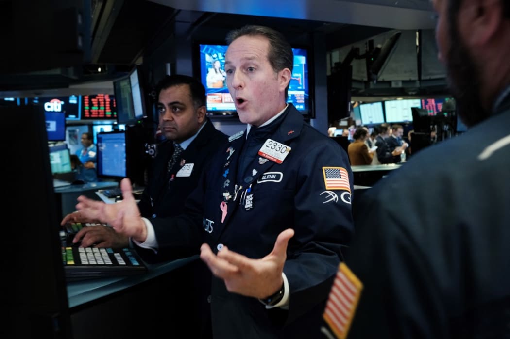 Traders work on the floor of the New York Stock Exchange (NYSE) on March 09, 2020 in New York City. As global fears from the coronavirus continue to escalate, trading was halted for 15 minutes after the opening bell as stocks fell 7 percent.