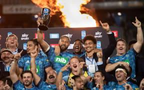 Blues players celebrate after winning the Super Rugby Trans-Tasman final.