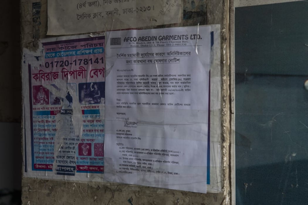 A notice on board tells about the factory shut down during the government imposed countrywide lock down amid concerns of coronavirus pandemic posing a risk of spreading Covid-19 in Dhaka.