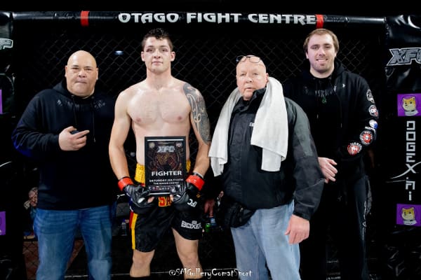 Rickson Hill (second from left) following a fight in Dunedin that left with with a bloodied eye.