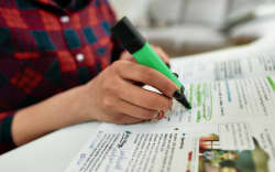 Cropped shot of a female student learning English.