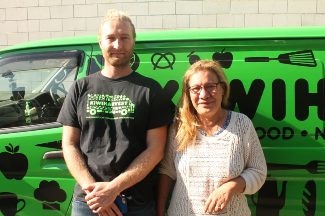 An image of Theresa Hellesoe from the Society of St Vincent de Paul and delivery driver Sam Mentink standing in front of the Kiwi Harvest van.