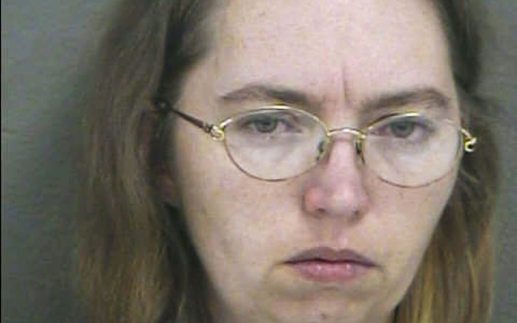Lisa Montgomery appears in a booking photo released 20 December 2004 in Kansas City, Kansas. Montgomery, of Melvern, Kansas, is accused of murdering the pregnant Bobbie Jo Stinnett, cutting the fetus from her body, and claiming the live baby as her own.