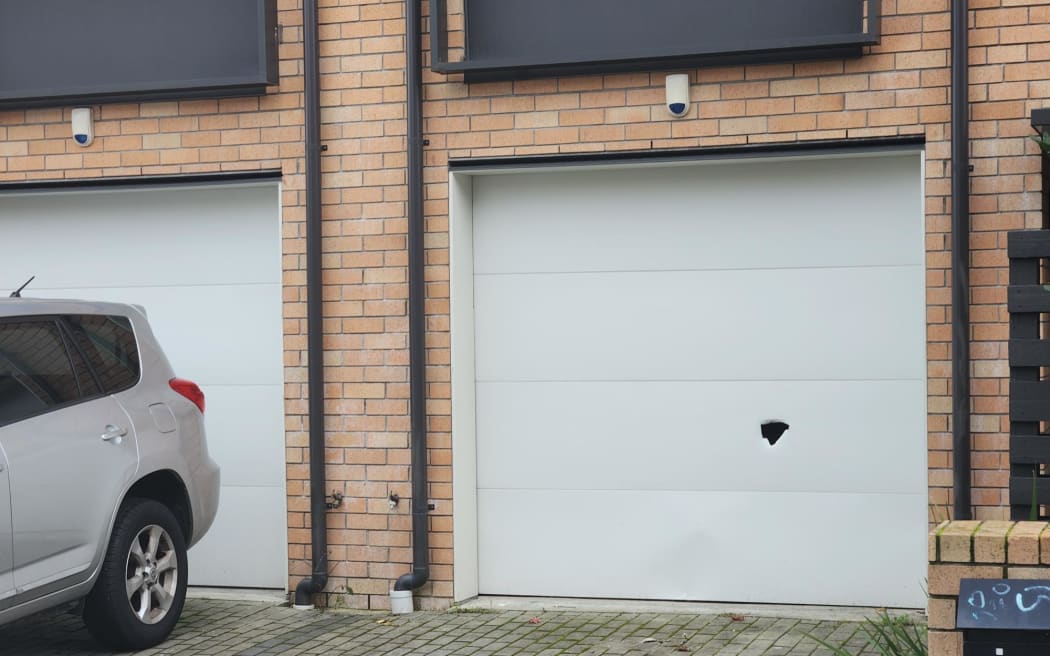 Garage door hit by bullet in Onehunga